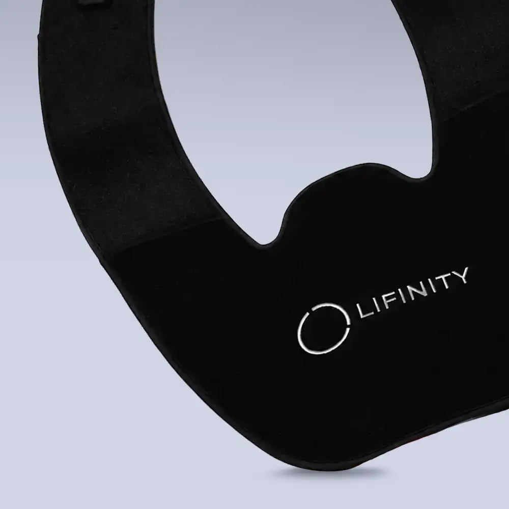 Close-up of a Lifinity black curved wearable belt with the LIFINITY logo printed in white on a light gray background.