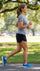 Woman jogging in a park on a sunny day